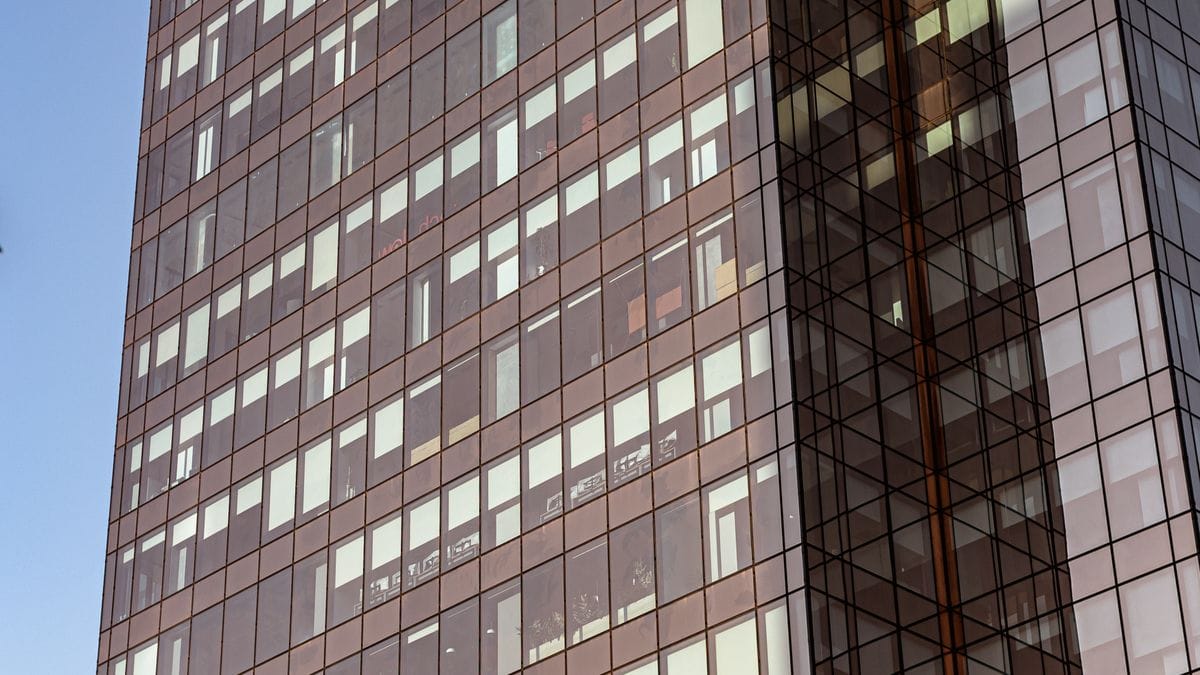 Glass office building representing home loans and banking in real estate