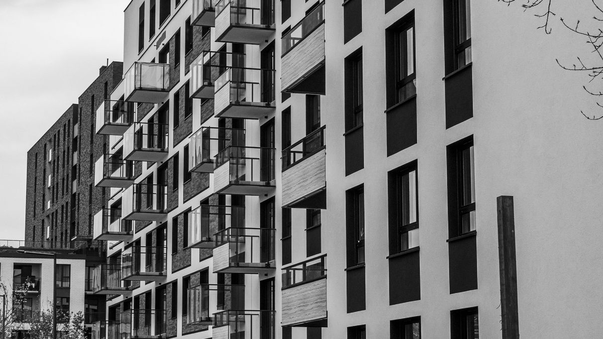 Contemporary urban apartment buildings representing real estate market trends